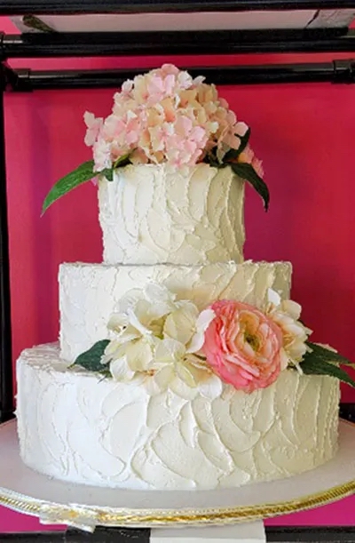 One of our signature wedding cakes design or texture: casually iced