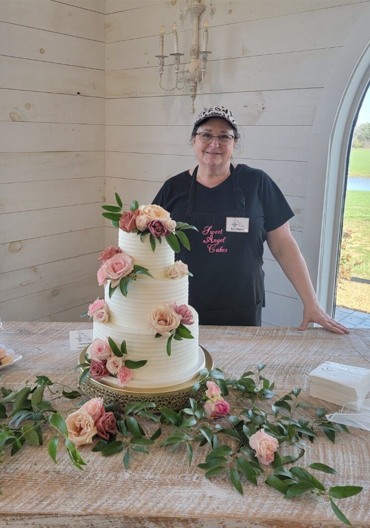About Sweet Angel Cakes - Toni standing behind wedding cake