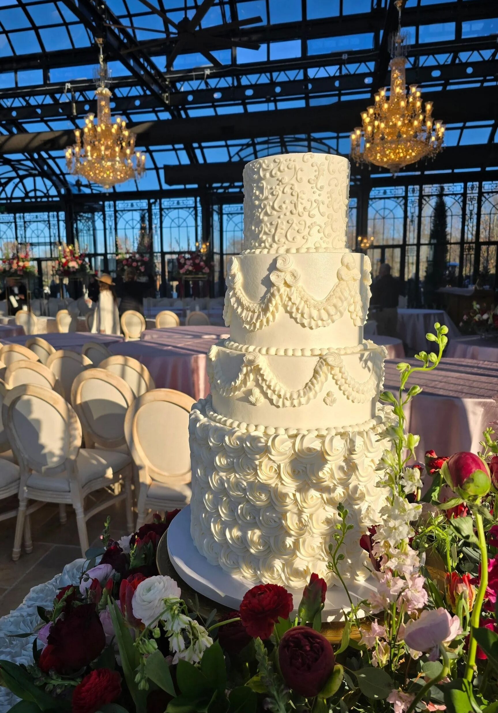 Wedding cake at reception featuring vintage piping design